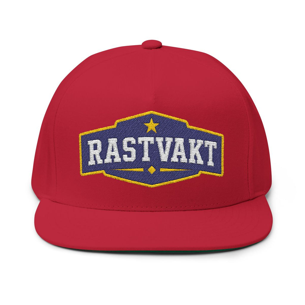 Röd broderad rastvaktskeps med tydligt RASTVAKT-emblem